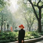 Group of diverse individuals collaborating on meme coin creation in a modern workspace